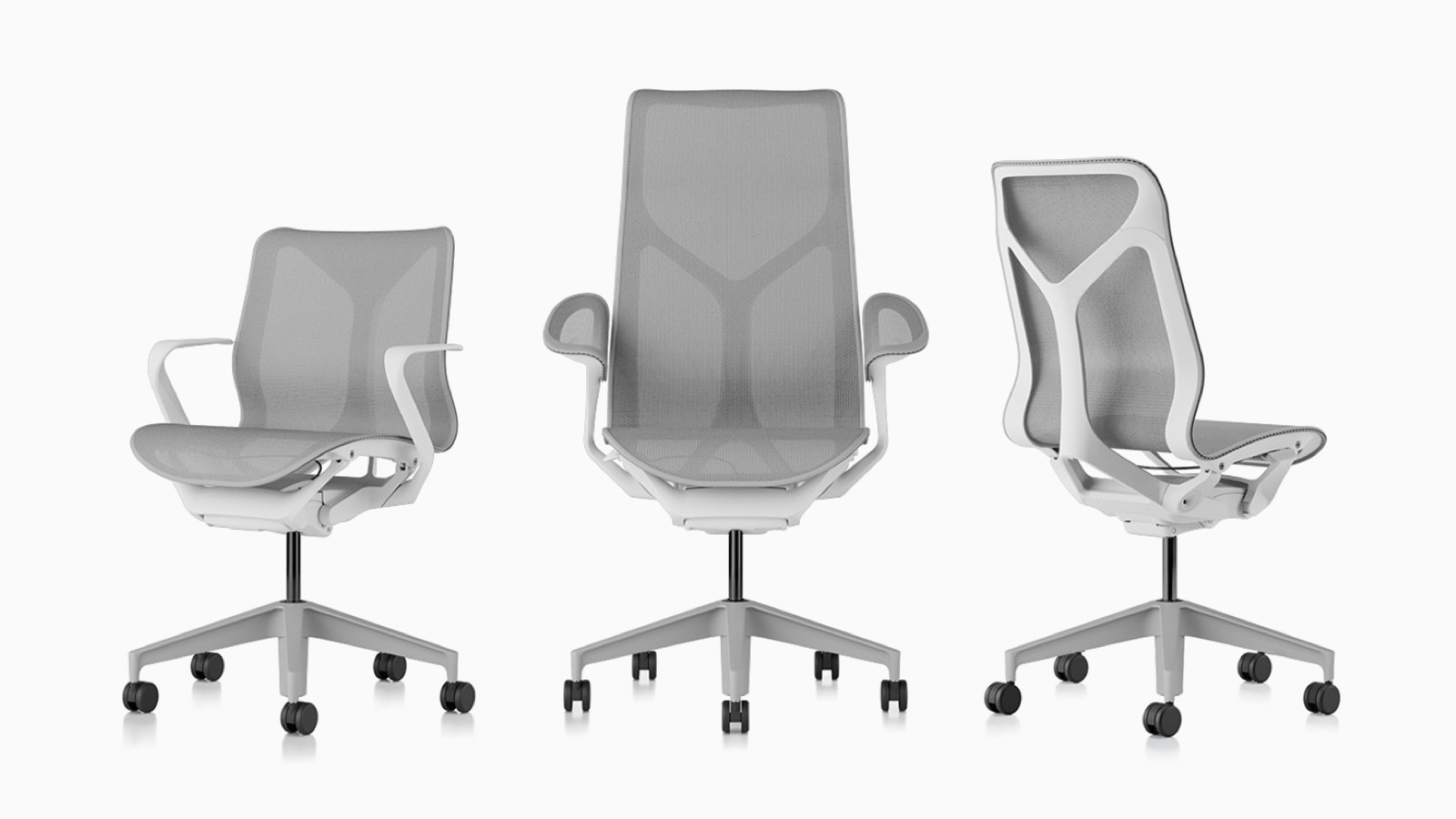 Low-back, high-back, and mid-back Cosm ergonomic desk chairs with bases and frames in Studio White and suspension materials in Mineral light gray.