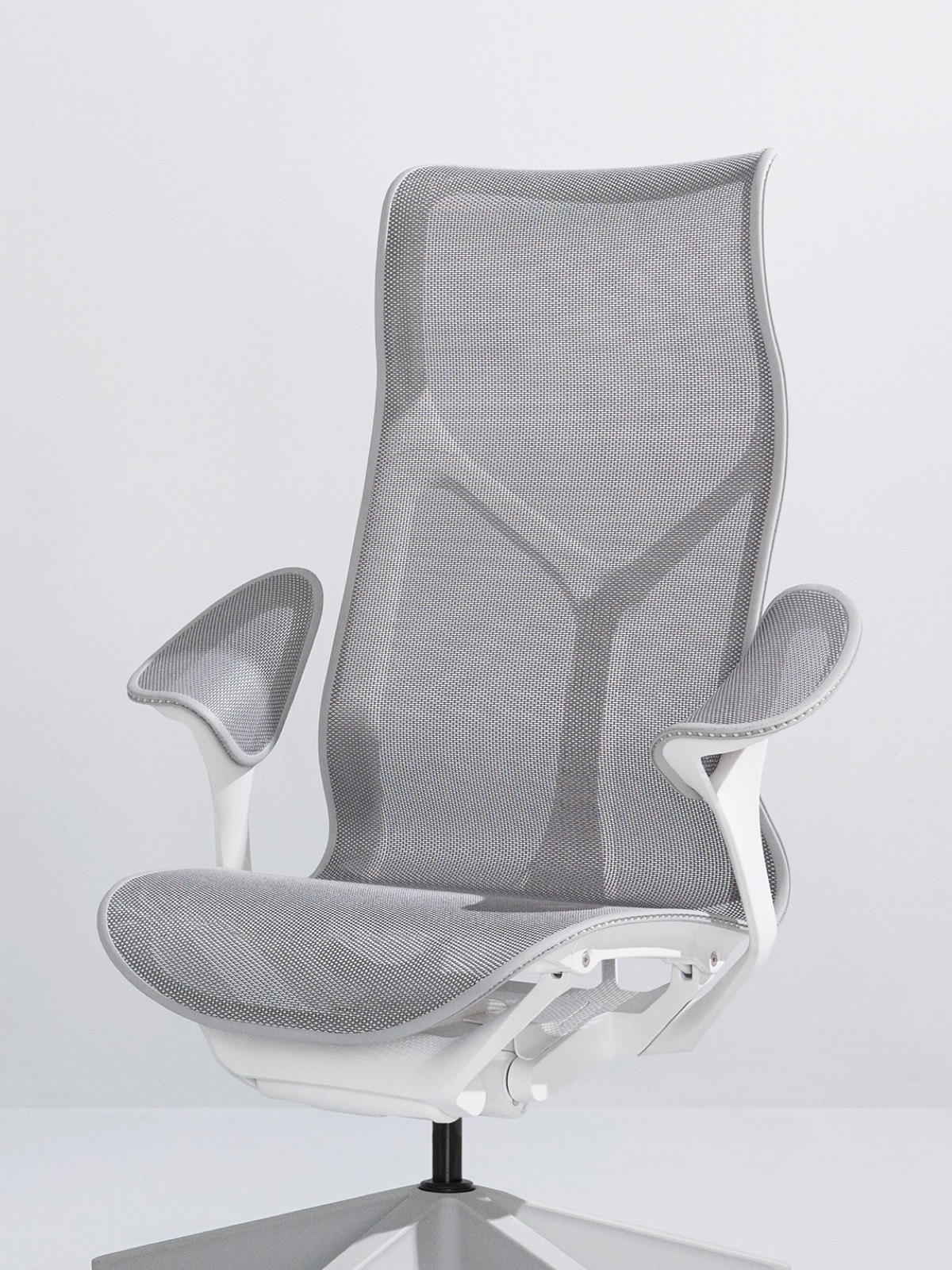 A Mineral gray high-back Cosm Chair with a white frame and leaf arms on a light gray background.